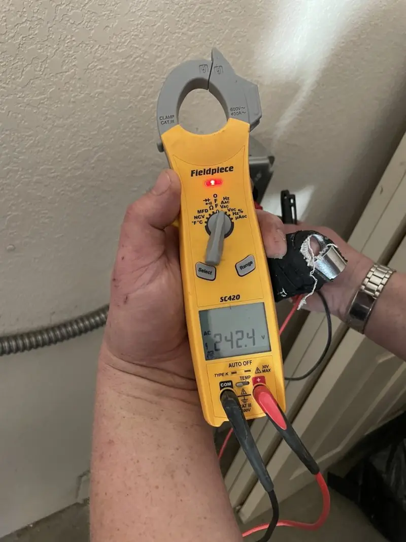 Voltage testing with clamp meter during Electrical Installation Services in Pikesville